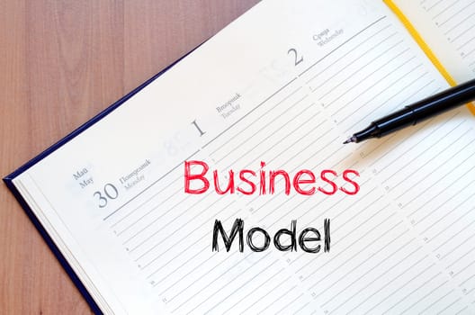 Business model text concept write on notebook