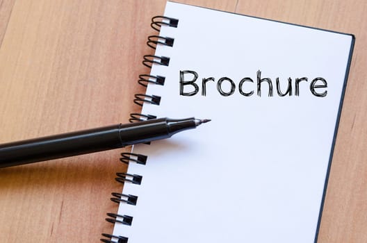 Brochure text concept write on notebook