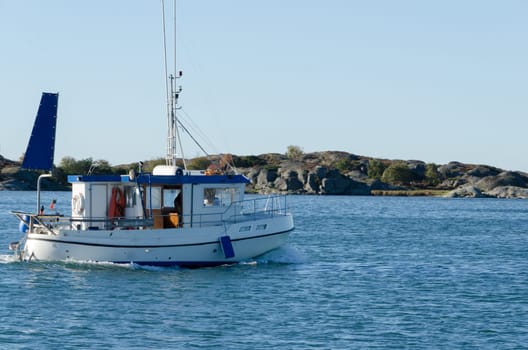 one small fishingboat on the swedish westcoast going out and fish