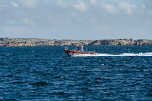 one little fast fishingboat on sweden westcoast on the way to the harbour