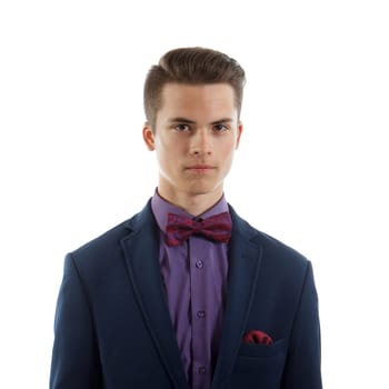 An elegant teenage boy wearing a suit