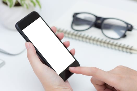 close up hand hold and finger touching on phone white screen