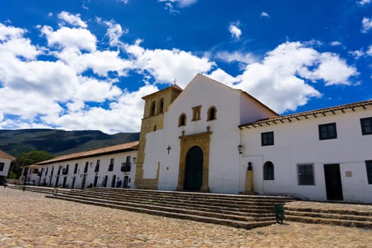 VILLA DE LEYVA, COLOMBIA - APRIL 29: Church and shops on the Plaza Mayor in Villa de Leyva, Colombia on April 29, 2016