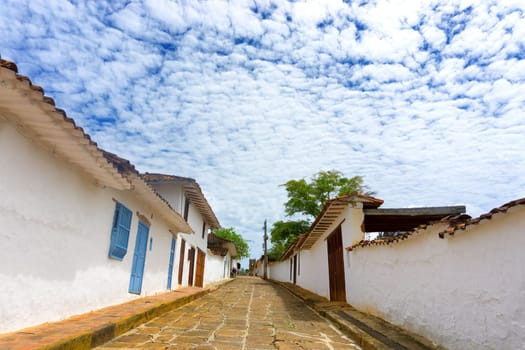 Sandstone street and white colonial architecture in Barichara, Colombia