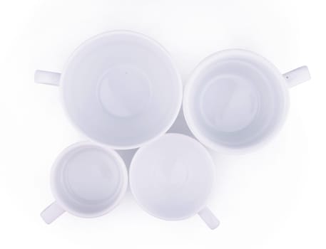 top view of white ceramic coffee cups isolated on white background