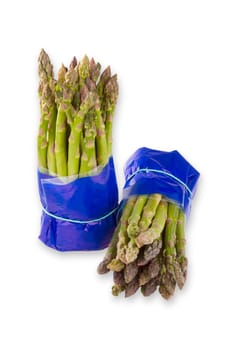 Fresh green asparagus exposed on a white background