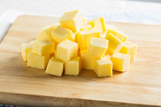 Cubes of butter on cutting board, horizontal