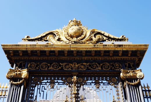 Golden decoration on main gate of Palace of Justice (Palais de Justice) in Paris, France