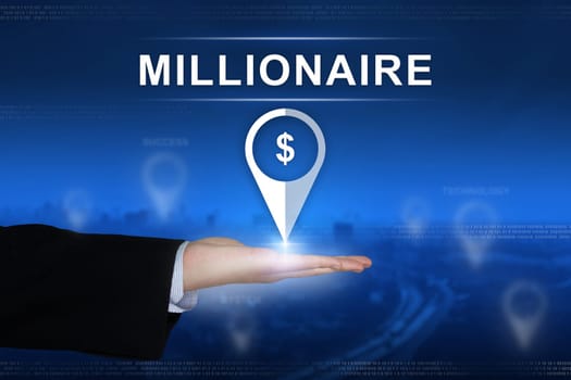millionaire button with business hand on blurred background