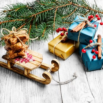 Christmas card with old fashioned Christmas sleigh of Santa Claus and Christmas gifts