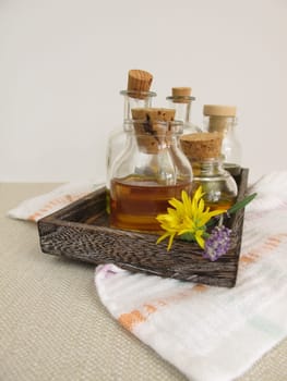 Vegetable oils for the skin in bottles on a tray