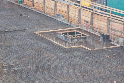 Foundation construction made of steel and concrete for the construction of an apartment building with underground parking. .