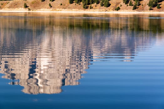 Teton Range reflected in Jackson Lake in Grand Teton National Park in Wyoming