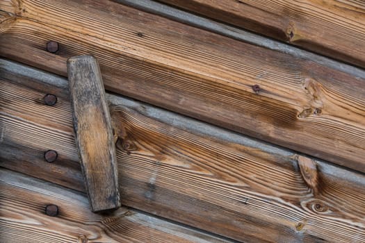 Close up view of a wooden handle of a door of a warehouse wood