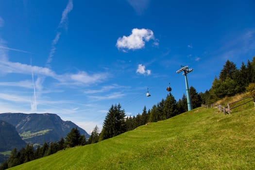 Bottom view of a cableway in a sunny day in Seiser Alm