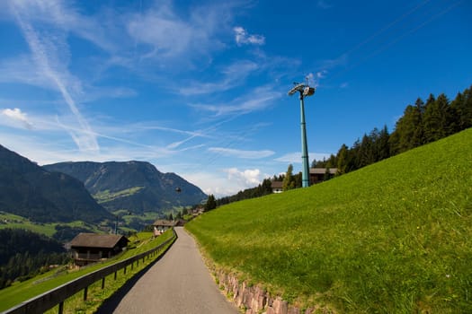 Bottom view of a cableway in a sunny day in Seiser Alm