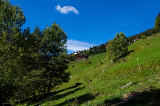 Distant view of a shelter in Seiser Alm on a sunny day