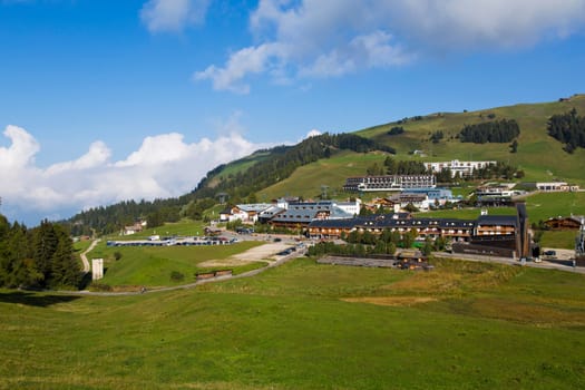 Panoramic view of the village of Compatsch on Seiser Alm on a sunny day