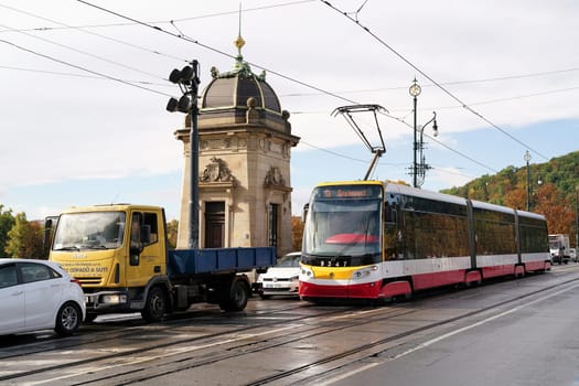 Road traffic during rush hour on a bridge in the Old Town of Prague