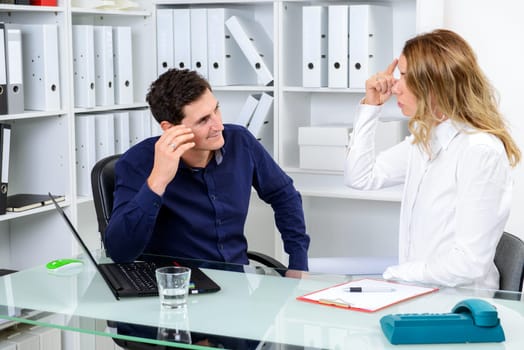 young business man and business woman in conflict
