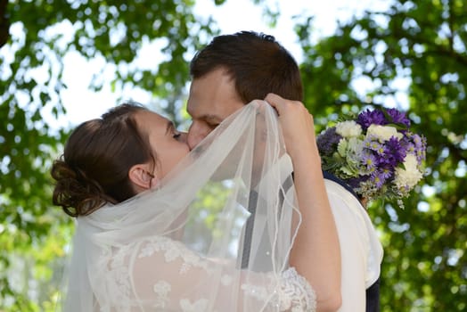 Kissing bridal couple