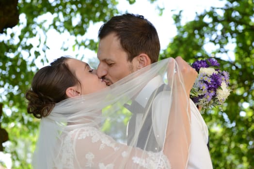 Kissing bridal couple