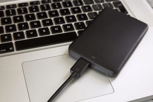 External Hard Disk Over Laptop Keyboard.