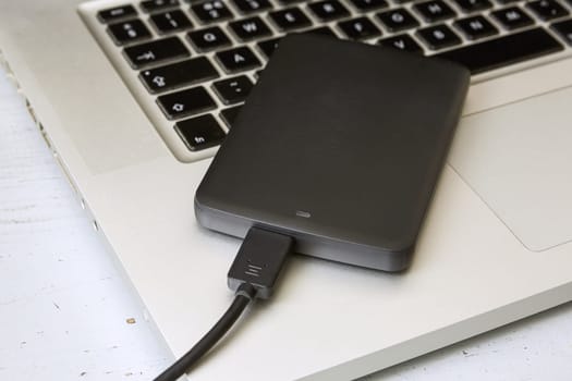 External Hard Disk Over Laptop Keyboard.