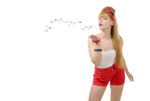 pretty pinup girl sending kisses and hearts isolated on white background