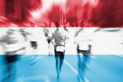 marathon runner motion blur blending with luxembourg flag