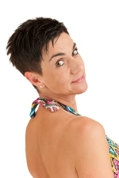 Head-and-shoulder view of a black-haired woman with a free shoulder from the right back against a white background smiling into the camera.
