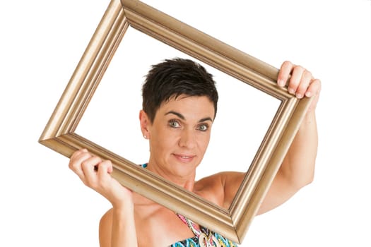 Upper body view of a middle-aged black-haired woman with gilded picture frames against a white background