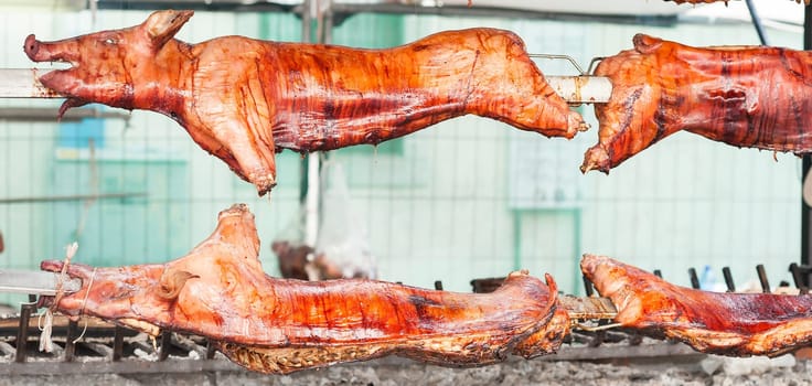 Baked roasted pork carcasses on the barbecue.