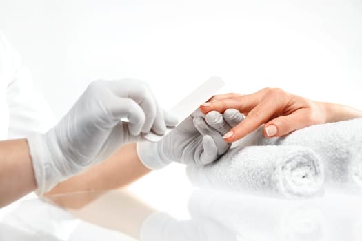woman hands during a manicure salon