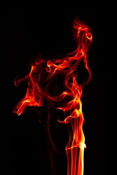abstract single fire flame on black background