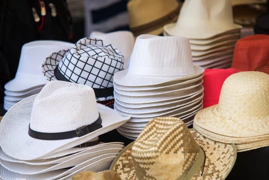 close up on hats of felt for sale at a flea market