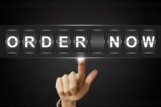 business hand pushing order now on Flipboard Display