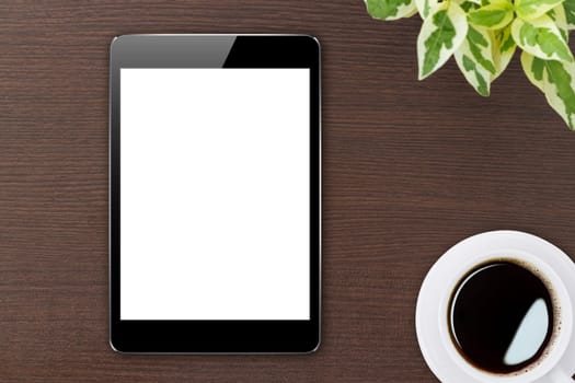 digital tablet blank screen on wood top view
