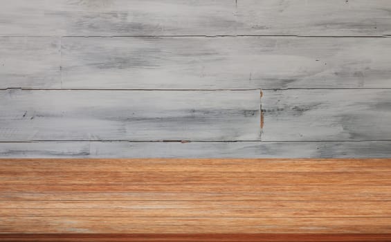 Top of wooden table with white wooden wall background. product display template