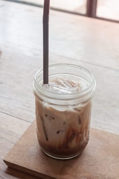 Iced coffee on wooden table, stock photo