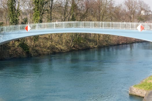 Pedestrian bridge made of steel in arch artery over the river Ruhr in Muelheim,Germany..
