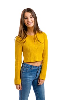 Beautiful and happy teenage girl pointing, isolated over white background