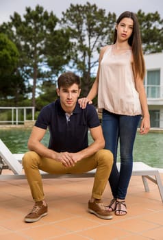 Beautiful young couple posing on a hotel