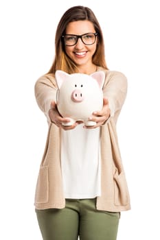 Beautiful and happy woman holding a piggy bank and making thumb up