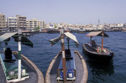 a city boat and ferry on the Dubai creek in the old town in the city of Dubai in the Arab Emirates in the Gulf of Arabia.