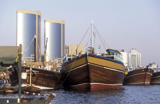 Import and export goods at the harbour at the Dubai creek in the old town in the city of Dubai in the Arab Emirates in the Gulf of Arabia.