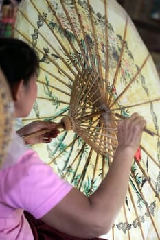 an Umbrella Factory near the city of chiang mai in the north of Thailand in Southeastasia. ...
