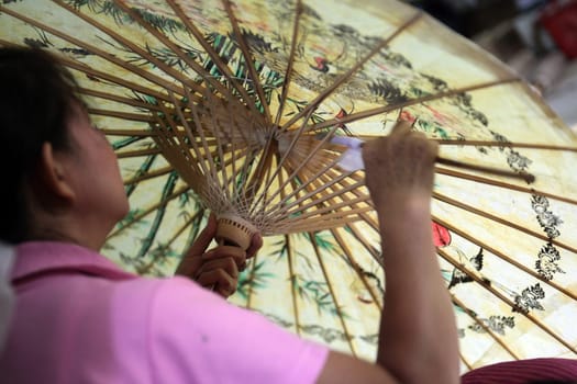 an Umbrella Factory near the city of chiang mai in the north of Thailand in Southeastasia. ...