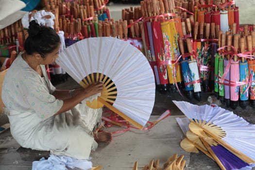 an Umbrella Factory near the city of chiang mai in the north of Thailand in Southeastasia. ...