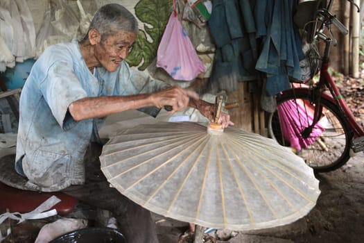 an Umbrella Factory near the city of chiang mai in the north of Thailand in Southeastasia. ...